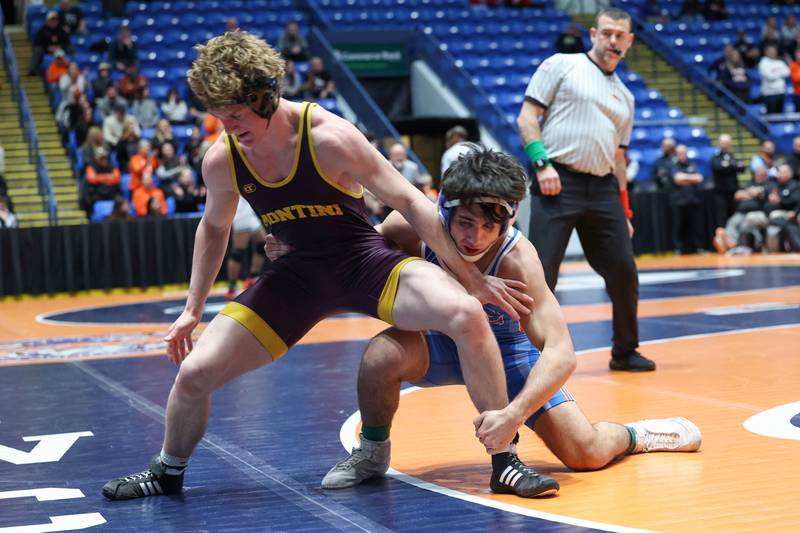 Marmion Academy's Zach Stewart, right, grabs hold of Montini's Kam Luif in his 150-pound match win during Marmion Academy's victory over Montini in the IHSA Class 3A Dual Team State championship on Saturday, Feb. 28, 2026.