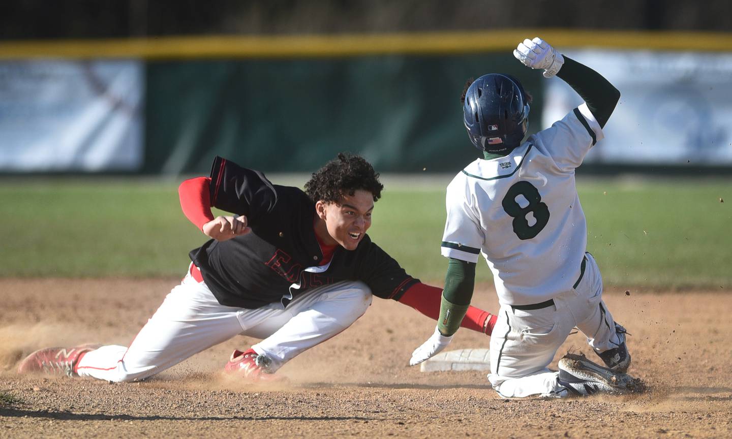 Glenbard East's Jayden Hamilton tags out Bartlett's Tyler Henricks at second base during Thursday's baseball game in Bartlett.