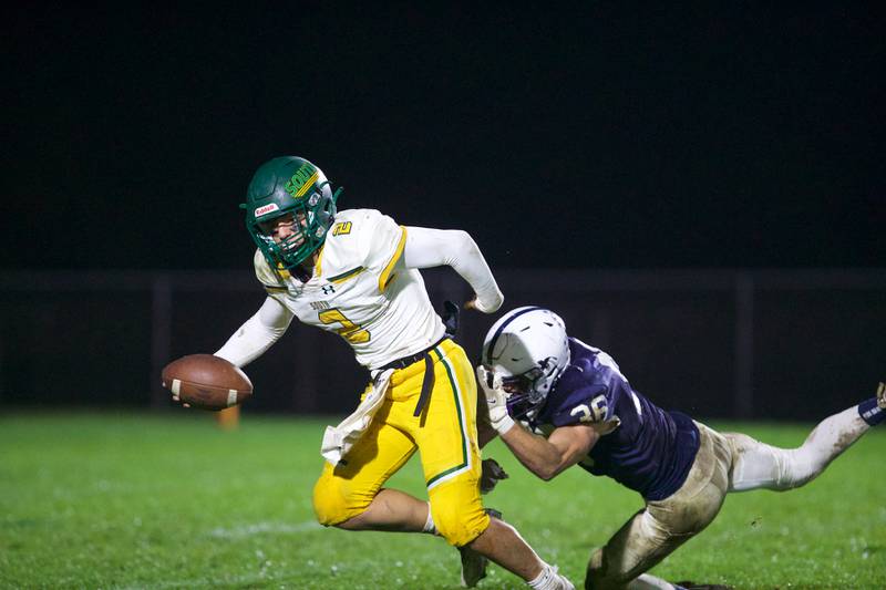 Crystal Lake South's Caden Casimino is tackled by Cary - Grove's Kyle Jarecki on Friday, Oct. 13 2023 in Cary Grove.