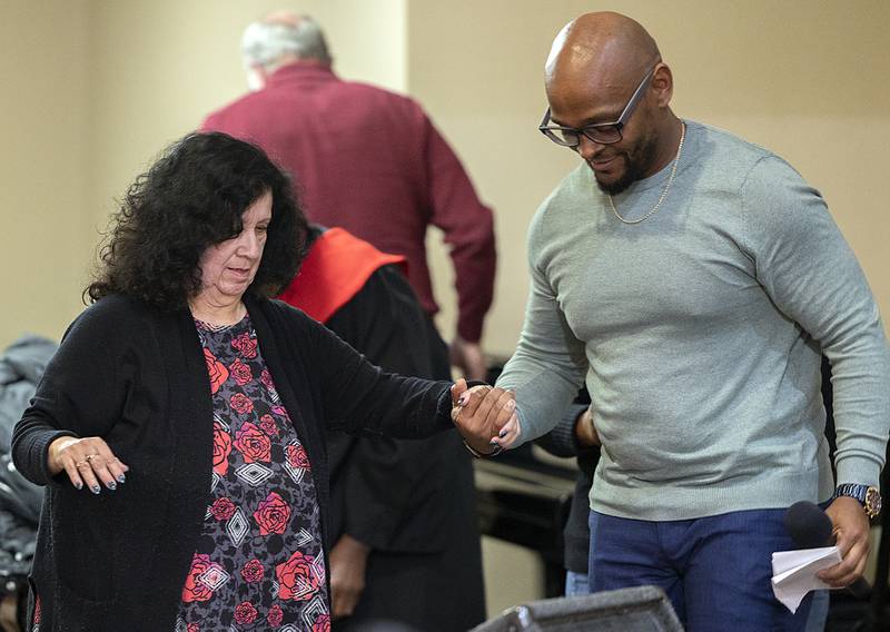 Irma Linda Lewis is helped to the stage by Rashaad Lane to receive the Dr. MLK Peace and Justice Award Sunday, Jan. 19, 2025.