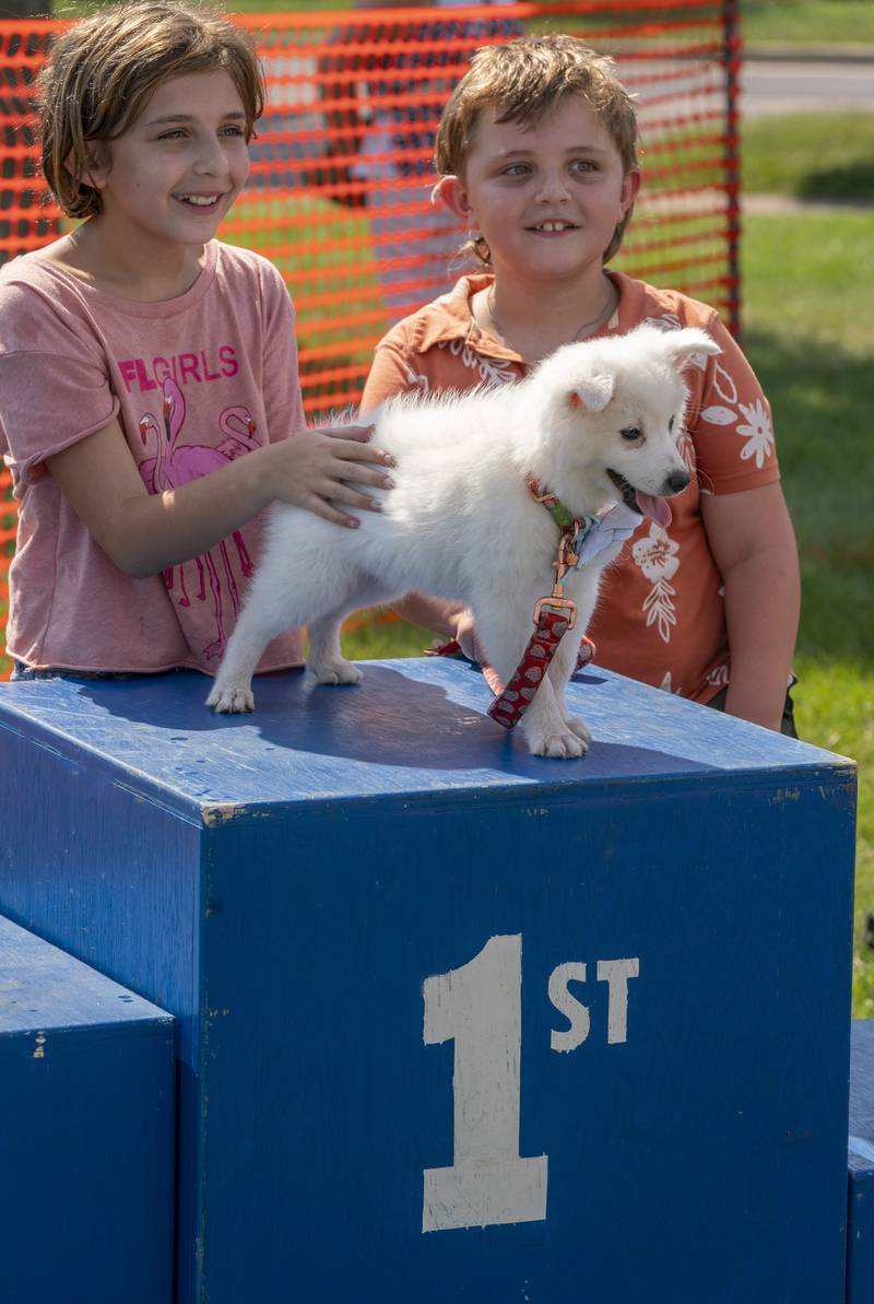 "Her face, just look at it." Says Harper Reimann, 9, of Glen Ellyn, along with brother Tommy, 8, as she describes why her dog Estelle, took 1st place in the Best Puppy event during the 7th Annual VetBros Charity Dog Show on Sunday, August 4th, 2024 at the Ross Ferraro Town Center in Carol Stream. The fluffy four month old American Eskimo puppy took the top prize in the category during the event which featured awards, vendors, a dog agility course and a doggy water play area. All proceeds benefited the VetBros Pet Education Charitable Fund which helps community pet owners in need.