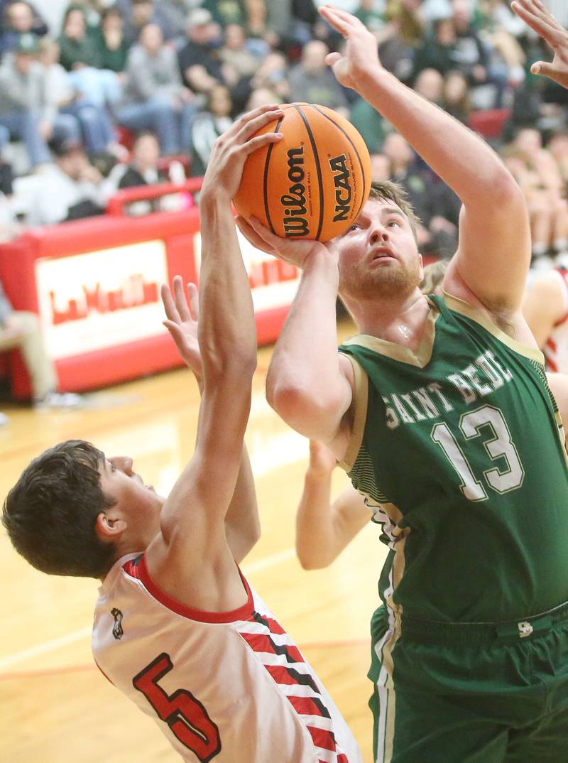 St. Bede's Jose De La Torre has his shot blocked by LaMoille's Braden Fischer on Tuesday, Feb. 11, 2025 at LaMoille High School.