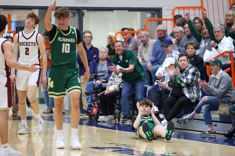 Bishop McNamara's Jayson Benton applauds from the ground after drawing a foul during the Fightin' Irish's 77-70 loss to Tolono Unity in the IHSA Class 2A Pontiac Supersectional on Monday, March 9, 2026.