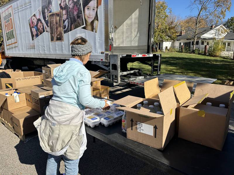 A volunteer helps set up the Northern Illinois Food Bank’s Advocate Condell Rx Mobile Market in Lake Villa.