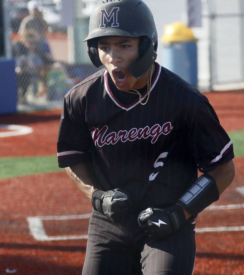 Marengo's Brayden Jenkins celebrates scoring a run during a Kishwaukee River Conference baseball game against Johnsburg  on Wednesday, April 22,2026, at Johnsburg High School.