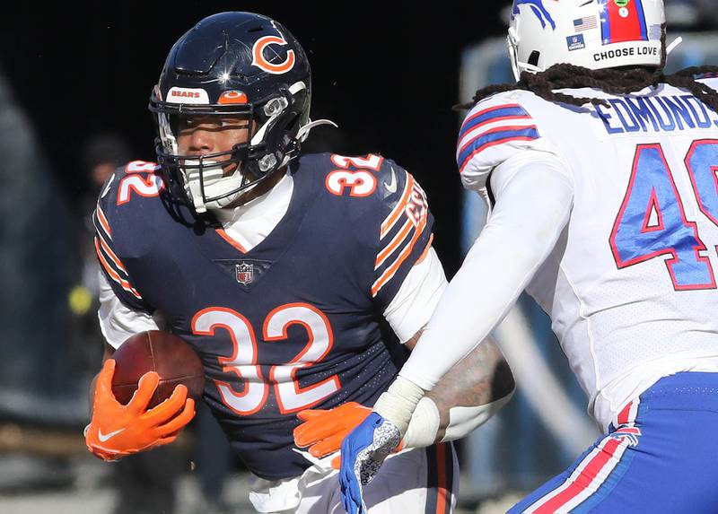 Chicago Bears running back David Montgomery looks to get outside of Buffalo Bills linebacker Tremaine Edmunds during their game Sunday, Dec. 24, 2022, at Soldier Field in Chicago.