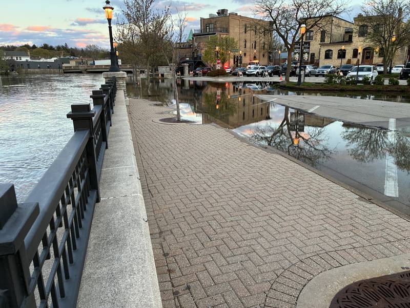 West Dundee's First Street parking lot is blocked off because of rising water on the adjacent Fox River.