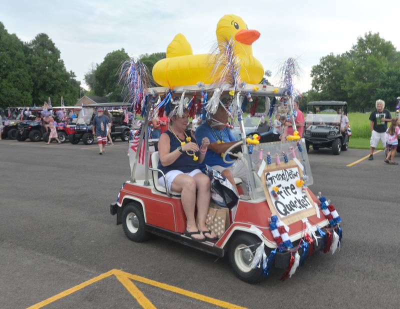 Mark and Linda Downey's "Grand Detour Fire Quacker" heads out for the Fifth Annual Grand Detour Golf Cart Parade on July 1.