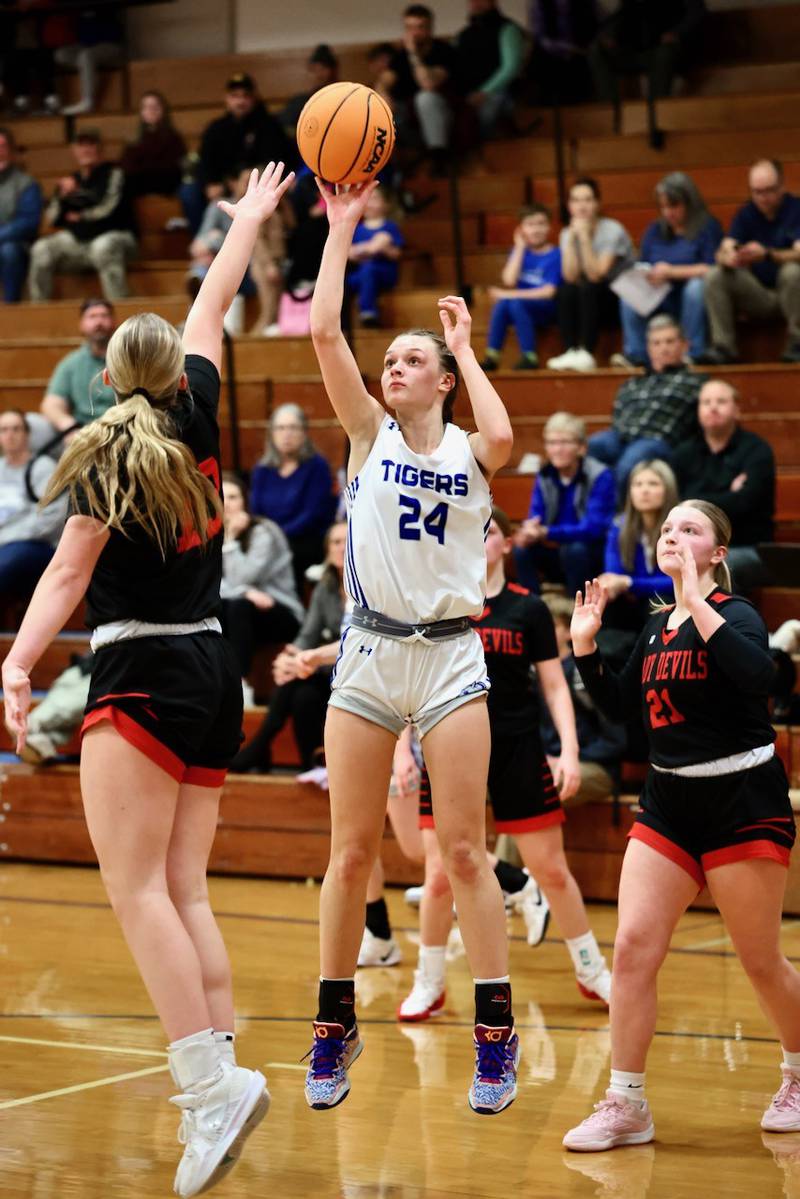 Princeton's Keighley Davis shoots over Hall's Caroline Morris in Tuesday's. rivalry game at Prouty Gym. The Tigresses won 41-39 to improve to 13-0 on the year.