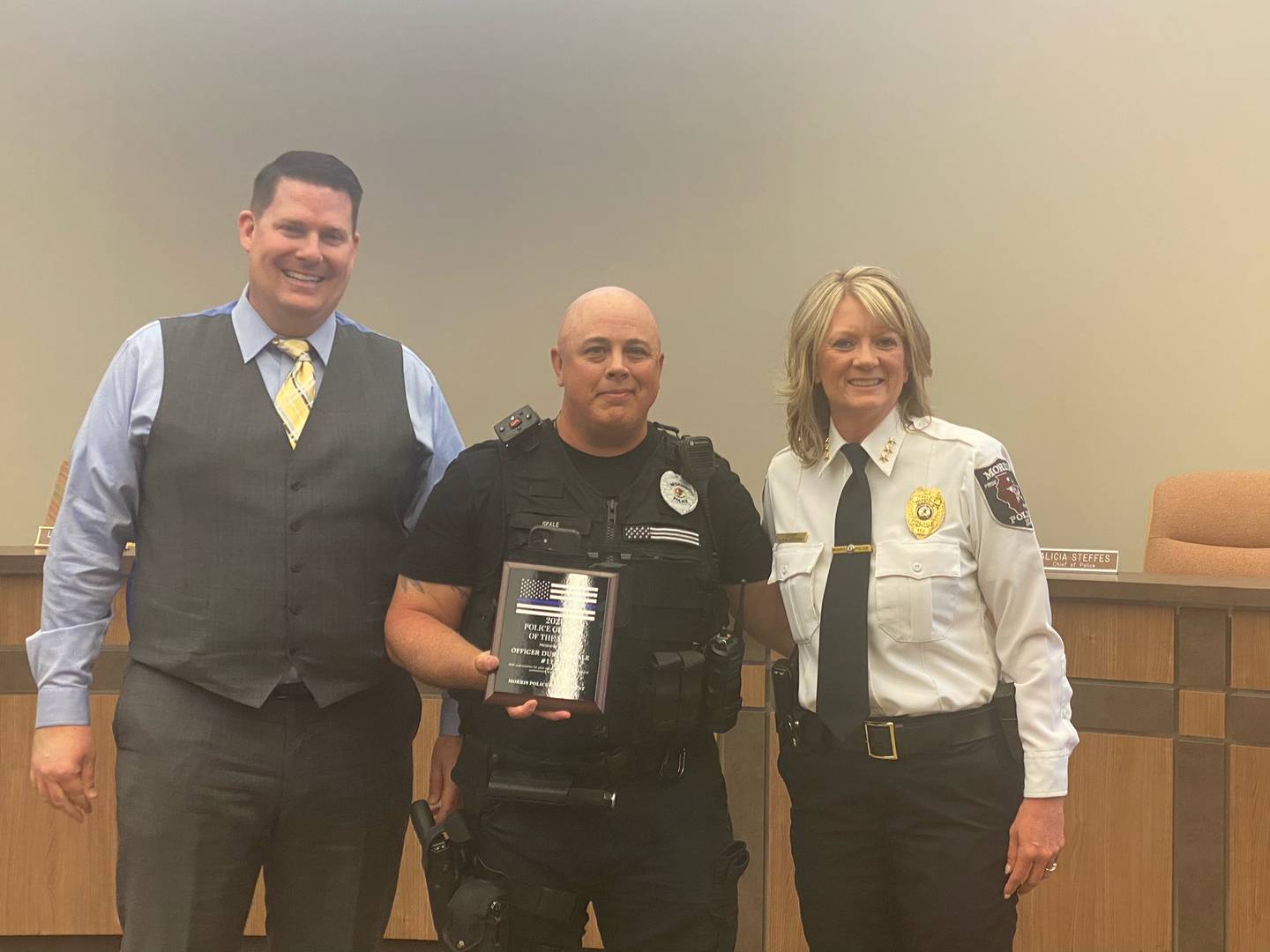 Mayor Chris Brown and Chief Alicia with Officer of the year Dustin Seale.