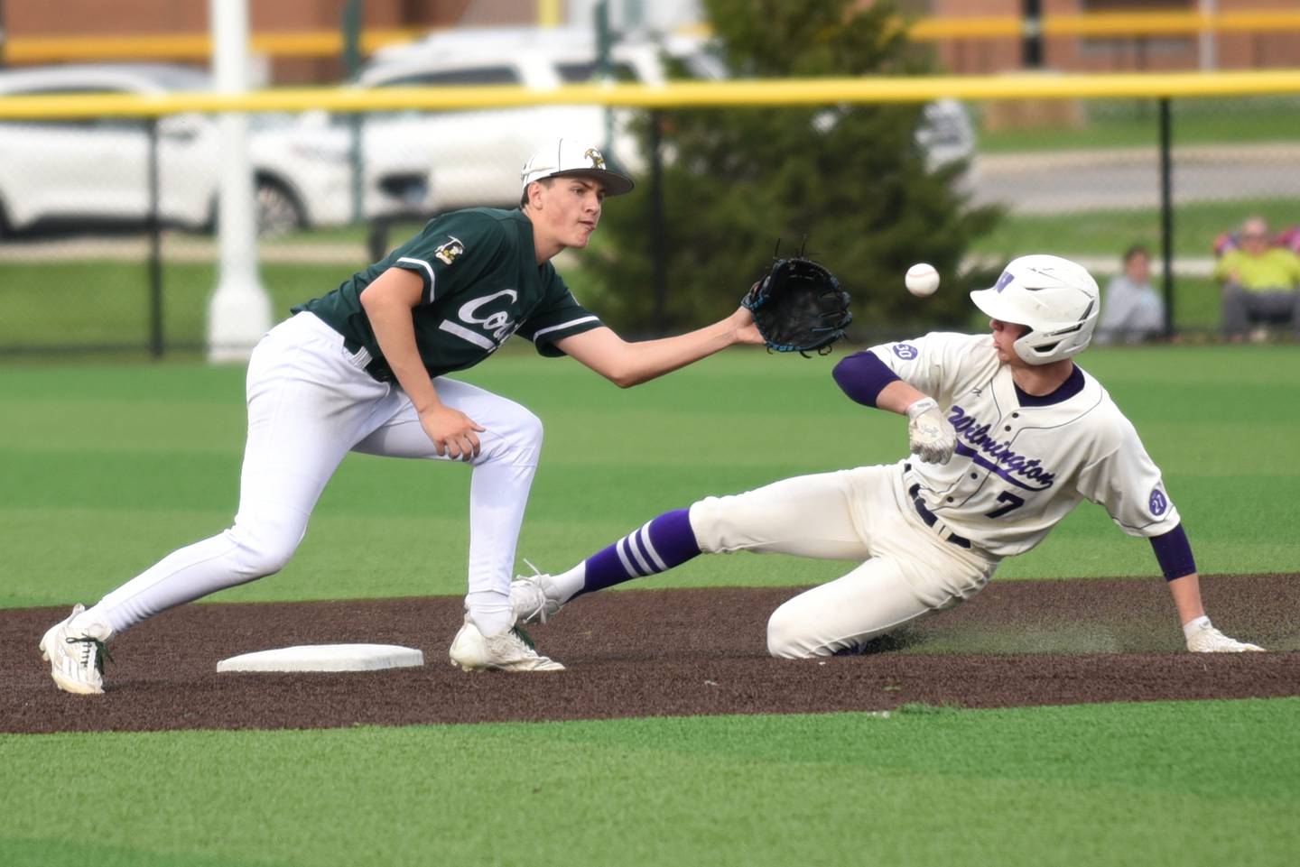 Coal City's Kellen Forsythe, left, fields a throw at second base as Wilmington's Cooper Holman slides in safely during a game at Coal City Wednesday, April 15, 2026.