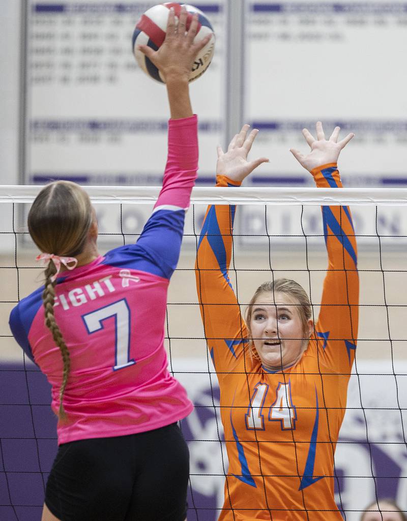 Genoa-Kingston’s Keiragan Gleissner goes ups for a block against Dixon’s Makenzie Toms Thursday, Oct. 17, 2024.
