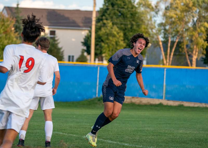 Oswego East's Josh Lopez (26) reacts after scoring a goal on a header off of a cross by Dupablo Parodis-Yu (not pictured) during a soccer match at Oswego East High School on Monday, Sep 26, 2022.