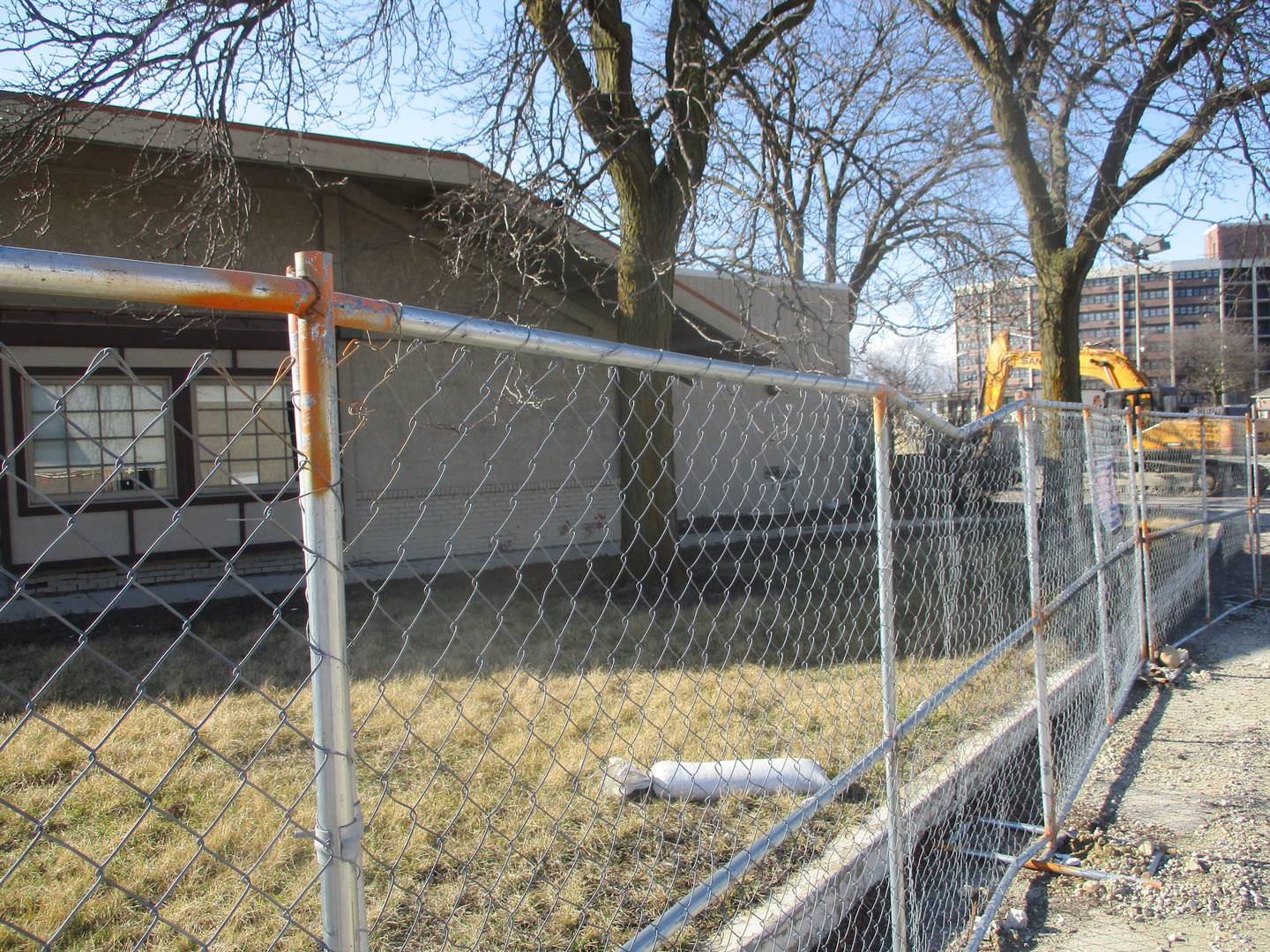 Demolition fencing surrounds the former Bakers Square restaurant on Jefferson Street in Joliet. The building will be torn down and replaced by a new Starbucks. Feb. 25, 2024