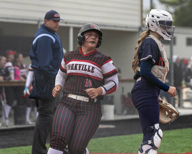 Yorkville's Kayla Kersting (10) crosses the plate for a run during softball game between Oswego at Yorkville. May 5, 2026 in Yorkville.