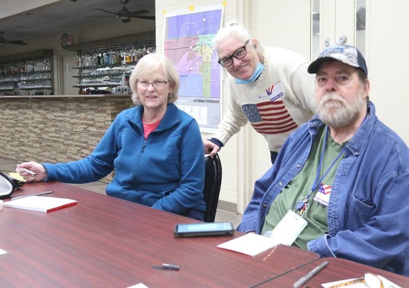 Election judges (from left) Denise Hudkins, Shawn McLaughin and Mike Gage pose for a photo on Tuesday, March 19, 2024 at the Knights of Columbus in Ottawa.