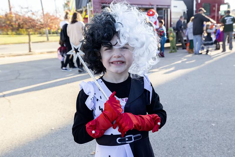 Harper Ruiz, 4, looks more cute than cruel while dressed at Cruella Deville Wednesday, Oct. 26, 2022 at the Sterling Police Department’s trunk or treat.