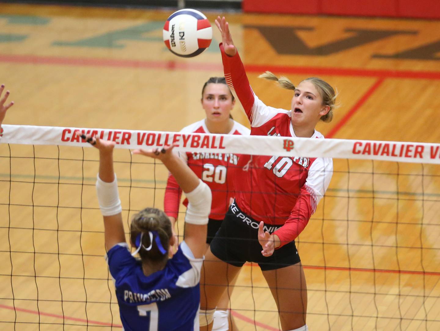 L-P's Kelsey Frederick sends a spike past Princeton's Kathy Maciczak on Tuesday, Aug. 26, 2025 in AJ Sellett Gymnasium at L-P High School.