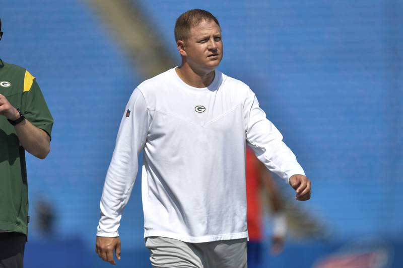 Green Bay Packers quarterbacks/passing game coordinator Luke Getsy walks on the field before a preseason game against the Buffalo Bills on Aug. 28, 2021. The Bears are reportedly hiring Getsy as the team's offensive coordinator.