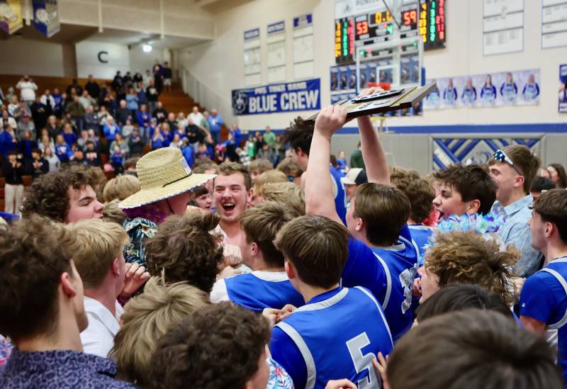 Princeton celebrates its 59-53 regional championship victory Seneca at Prouty Gym Friday night. It was Princeton's fourth straight regional title.