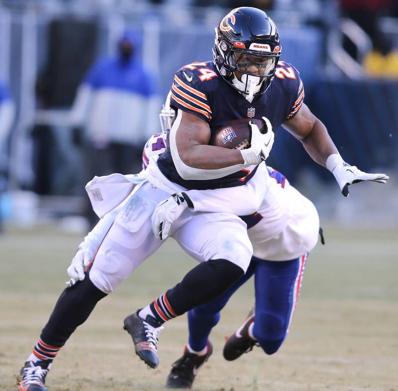 Chicago Bears running back Khalil Herbert gets past Buffalo Bills cornerback Kaiir Elam during their game Sunday, Dec. 24, 2022, at Soldier Field in Chicago.