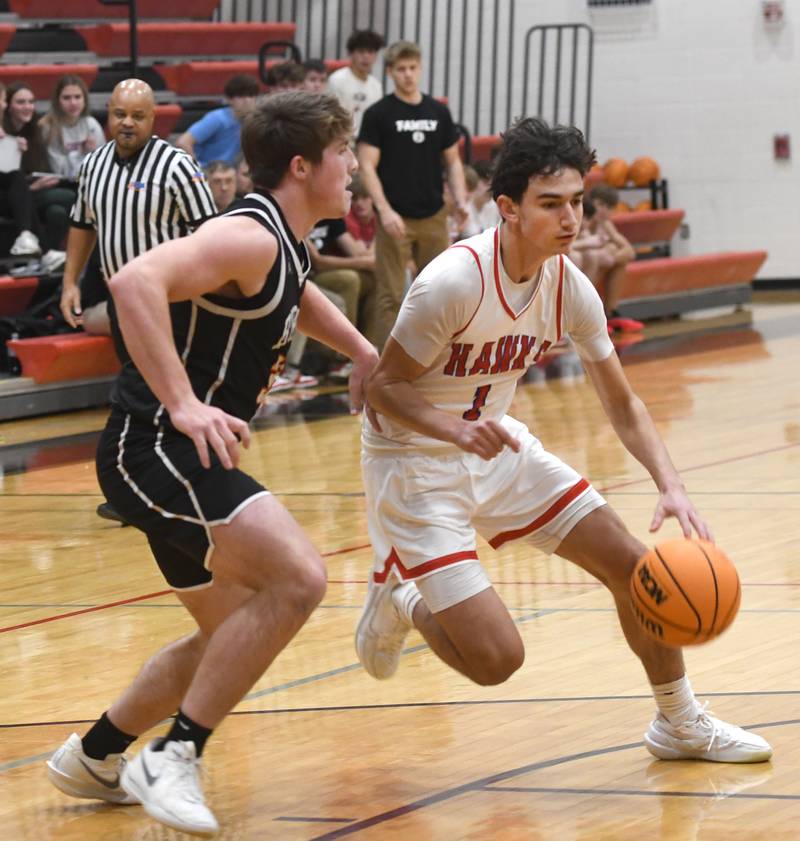 Oregon's Benny Olalde (1) drives to the basket as Byron's Caden Considine (33) defends during Monday, Dec. 15, 2025 action at the 64th Forreston Holiday Tournament at Forreston High School.