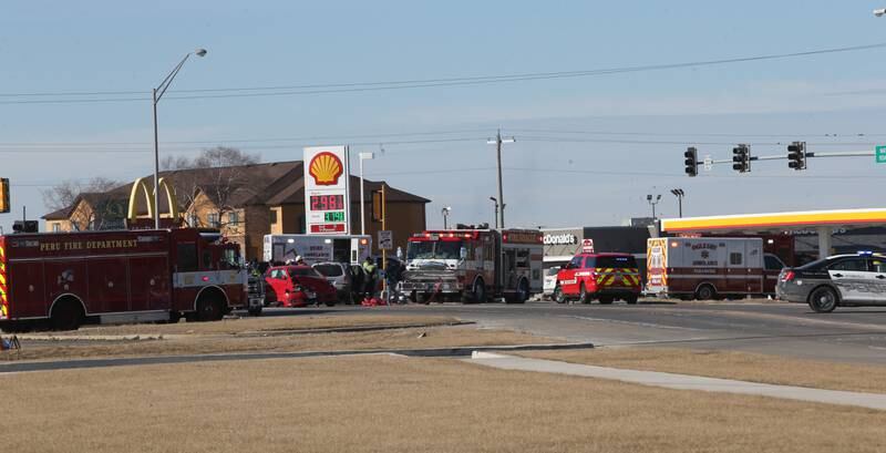 Emergency crews work the scene of a multiple vehicle crash at the intersection of Illinois Route 251 and May Road on Monday, May, 27, 2025 in Peru. The crash happened around 12:45p.m. Ambulances from Peru, La Salle, Mendota Spring Valley, and Oglesby responded to the scene to transport multiple victims to area hospitals.
