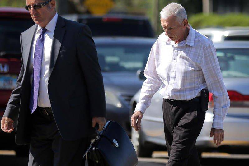 John Jacobson heads into the McHenry County Courthouse on May 7 in Woodstock. A McHenry County judge on Friday agreed to dismiss a drug charge against the former Hebron village president.