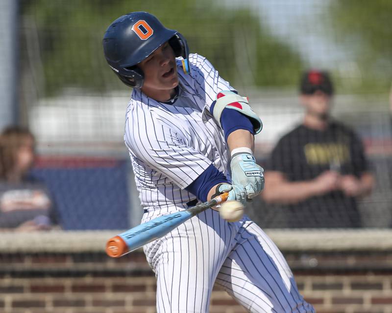 Oswego's Drew Kleinhans (4) swings at a pitch during baseball game Oswego East at Oswego.  May 14, 2026 in Oswego.