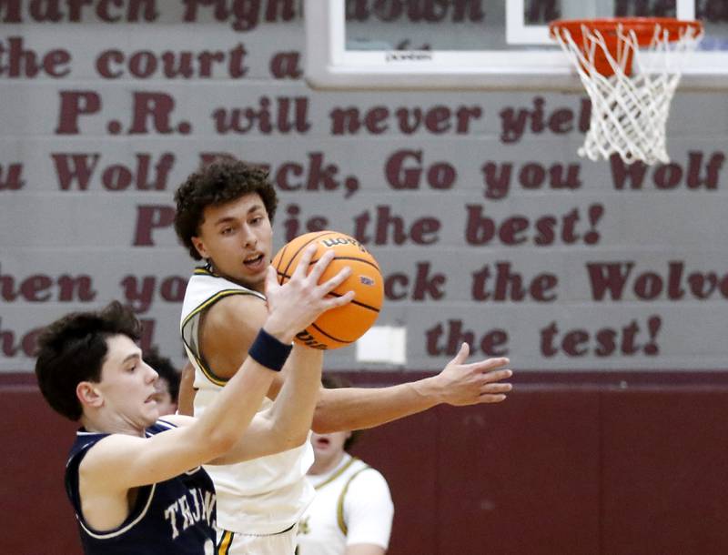 Cary-Grove's Dylan Dumele catches a pass in front of Crystal Lake South's Anthony Demirov during the IHSA Class 3A Prairie Ridge Regional championship basketball game on Friday, Feb. 28, 2025, at Prairie Ridge High School in Crystal Lake.