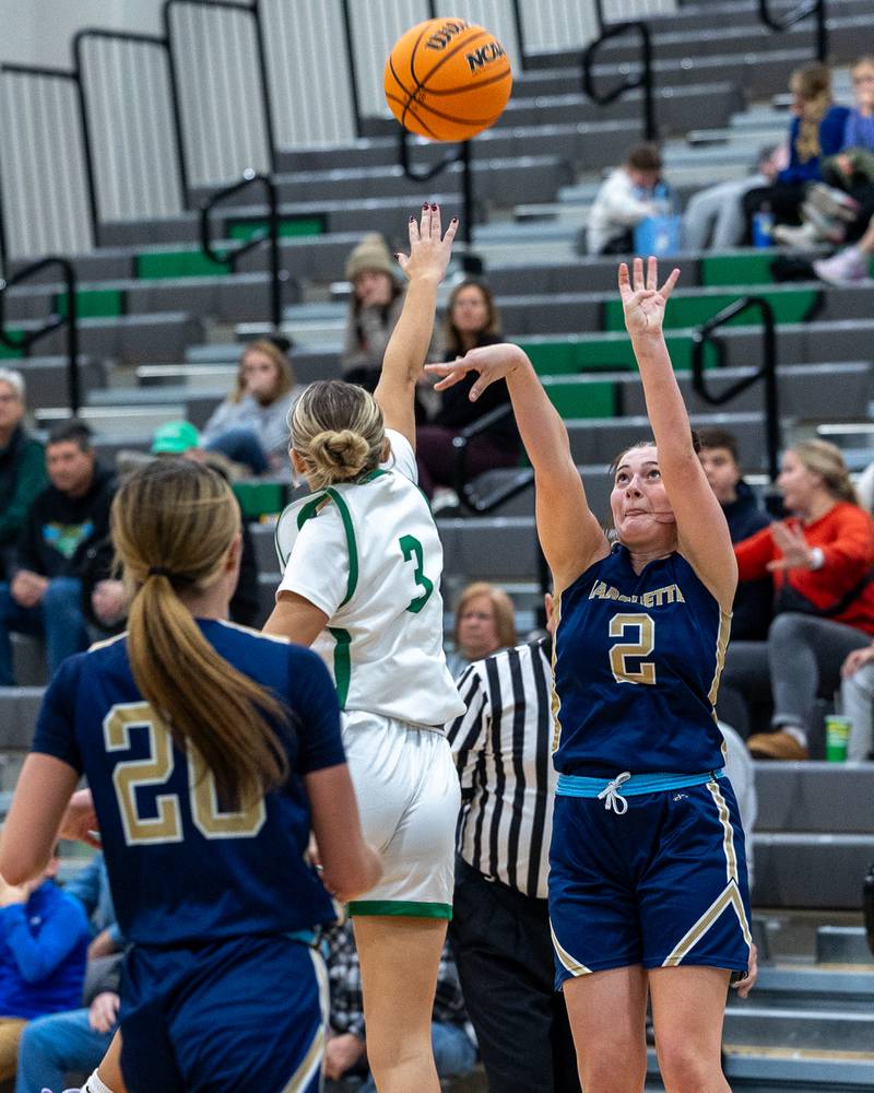 Kiley Rick (2) of Marquette shoots ball as Piper Stenzel (3) of Seneca jumps to block on Monday, November 17, 2025 at Seneca High School in Seneca.