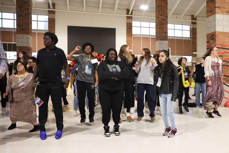 Students take the dance floor for the Cha Cha Slide at the annual Special Population Dance hosted by Joliet West high school on Friday, March 22, 2024.