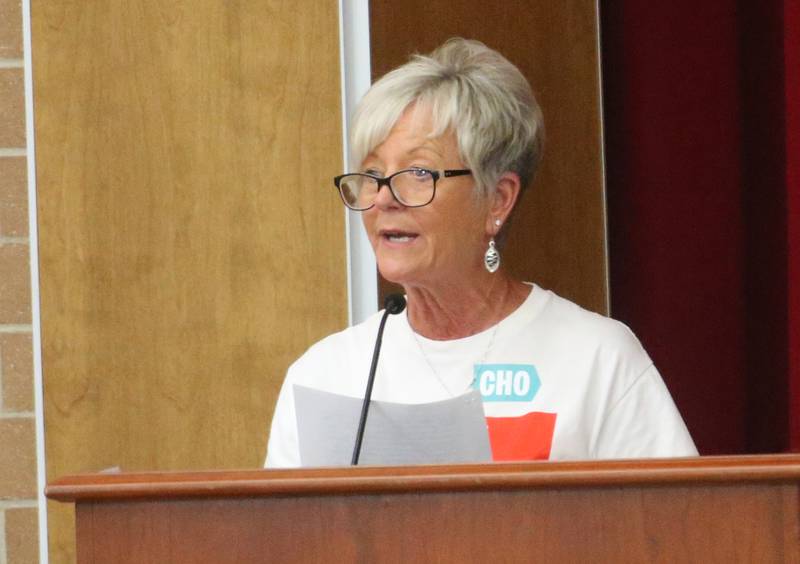 Ellen Rockfrord Wells speaks to the Illinois Health Facilities and Services Review Board during a public hearing regarding OSF St. Elizabeth Hospital's plans to reduce services on Tuesday, June 10, at Central Intermediate School in Ottawa.