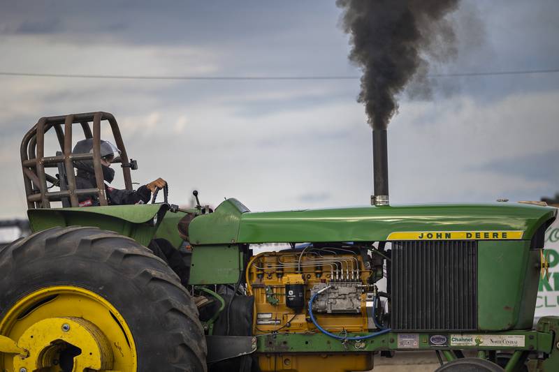 Bill Althaus fires up the JD Thursday, July 24, 2025, for his run in the pulls at the Lee County Fair.