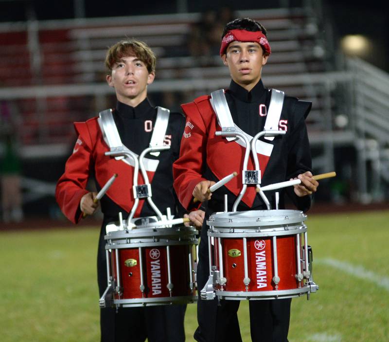 Oregon High School marching band drummers David Eckardt and Ethan Rowe peform during halftime of the football game with Rock Falls on Friday, Sept. 19, 2025.