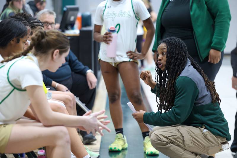 Bishop McNamara head coach Khadaizha Sanders talks to her team between quarters during the Fightin' Irish's 67-27 victory over Chicago Christian on Monday, Jan. 26, 2026.