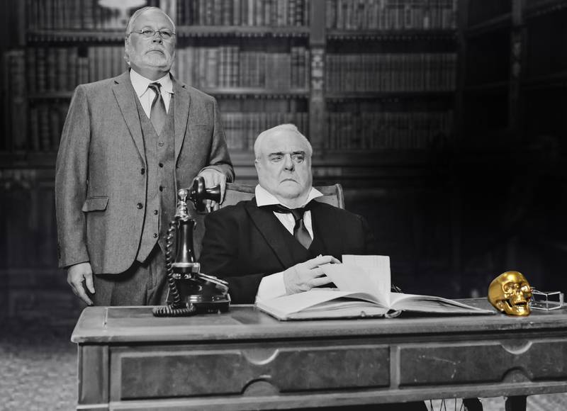 David Gasior (standing) as Jennings, Potter's manservant, and (seated) Frank Gaughan as Henry Potter in the new play "It's a Wonderful Christmas Carol," presented by Theater 121 in Woodstock.