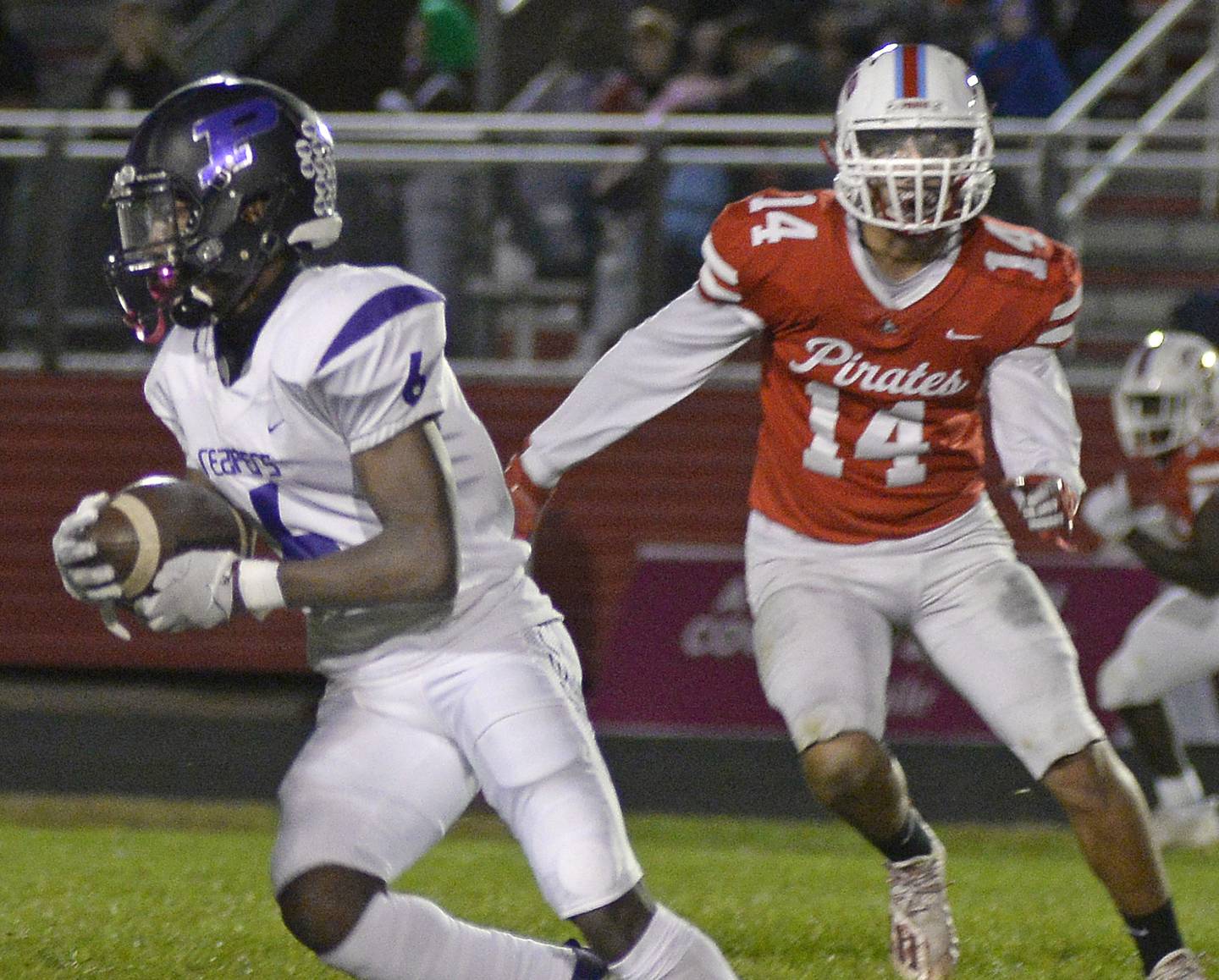 Plano’s Waleed Johnson breaks away from Ottawa’s Trey Donnelly (14) on a run in the second quarter Friday, Oct. 22, 2021, at Ottawa.