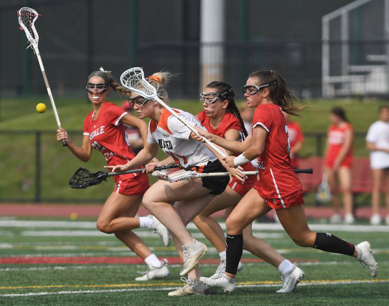 Crystal Lake Central Coop’s Ella Trudeau, middle loses the ball as she goes against Hinsdale Central’s Gabriella De Vita, left, Stefani Andrews and Peyton Moncrief, right ,during the third-place game of the girls lacrosse state finals at Hinsdale Central High School on Saturday, June 7, 2025.