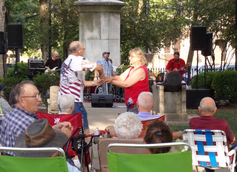 A couple dances to the Radium City Rebels on Saturday, July 2, 2022, during the opening performance of the 2022 Ottawa Music in the Park series in Washington Square.