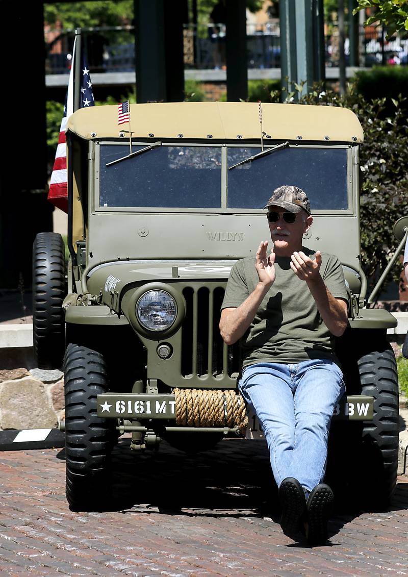 Matt Mondek of Wonder Lake watches the parade from his 11946 Willys during the Woodstock VFW Post 5040 City Square Memorial Day Ceremony and Parade on Monday, May 29, 2023, in Woodstock.