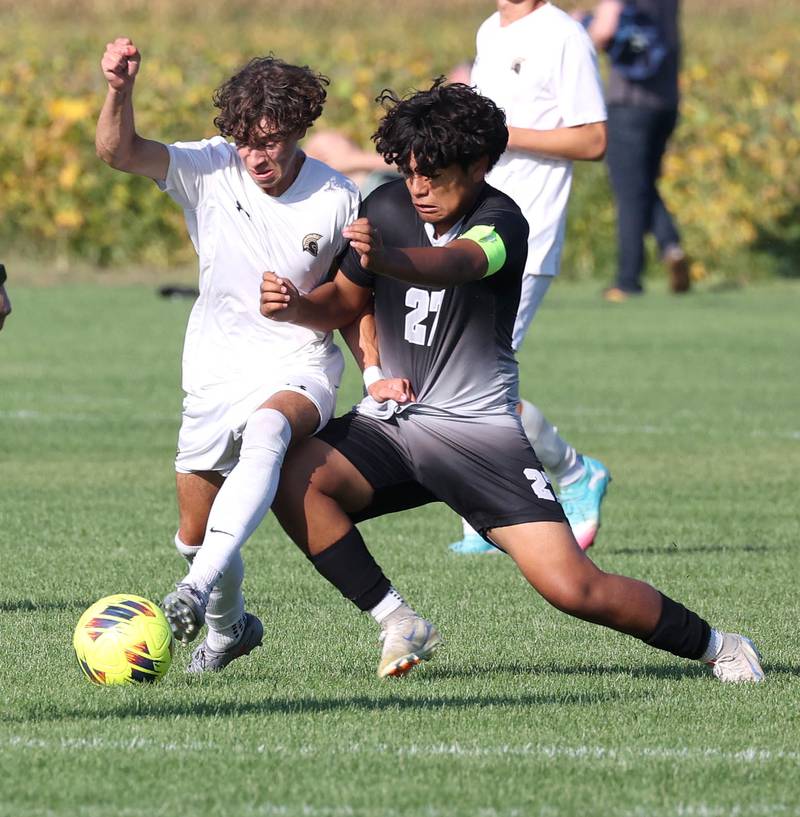 Sycamore's Noah Daykin (left) and Kaneland's Abe Paulino fight for possession during their game Wednesday, Sept. 16, 2025, at Kaneland High School in Maple Park.