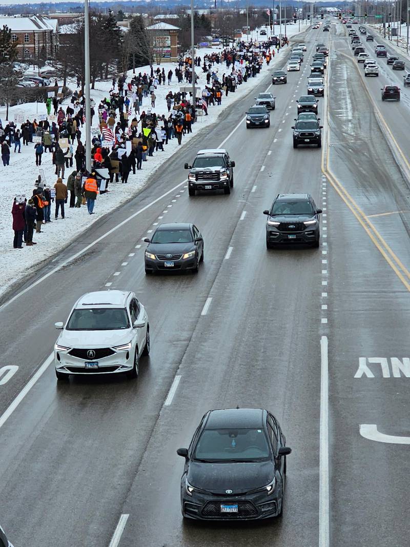 About 200 people protested on Randall Road in South Elgin Sunday, Jan. 25, 2026, against the latest ICE killing in Minnesota of Alex Pretti, an ICU nurse.