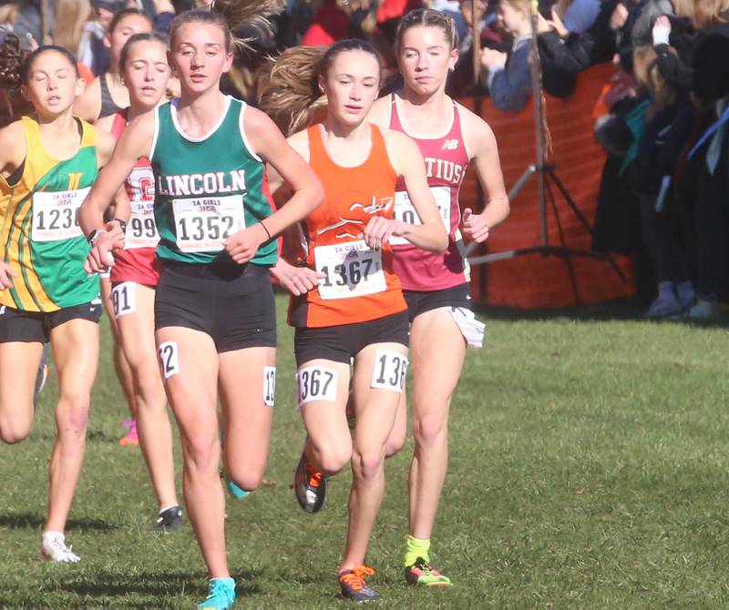 Sandwich's Sundara Weber (center) competes in the Class 2A State Cross Country race on Saturday, Nov. 4, 2023 at Detweiller Park in Peoria.