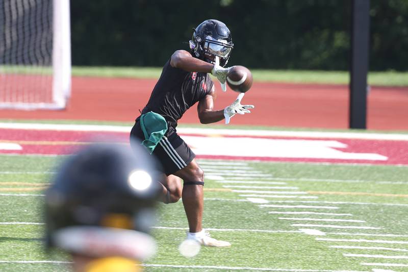 Bolingbrook’s Kaleb Miller pulls in a pass at the Morris 7 on 7 scrimmage. Tuesday, July 19, 2022 in Morris.