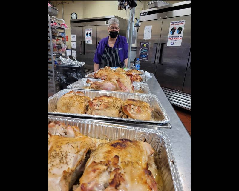 Gail Flatness prepared and cooked nearly a dozen turkeys at the Daybreak Center on Wednesday. The faith based organization is expected to serve over 100 meals to members of the community on Thanksgiving day in Joliet.