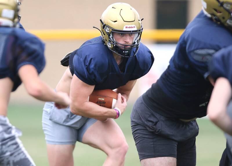 Hiawatha’s Lucas Norvell makes a one-handed catch during practice Wednesday, August 9, 2023, at the school in Kirkland.