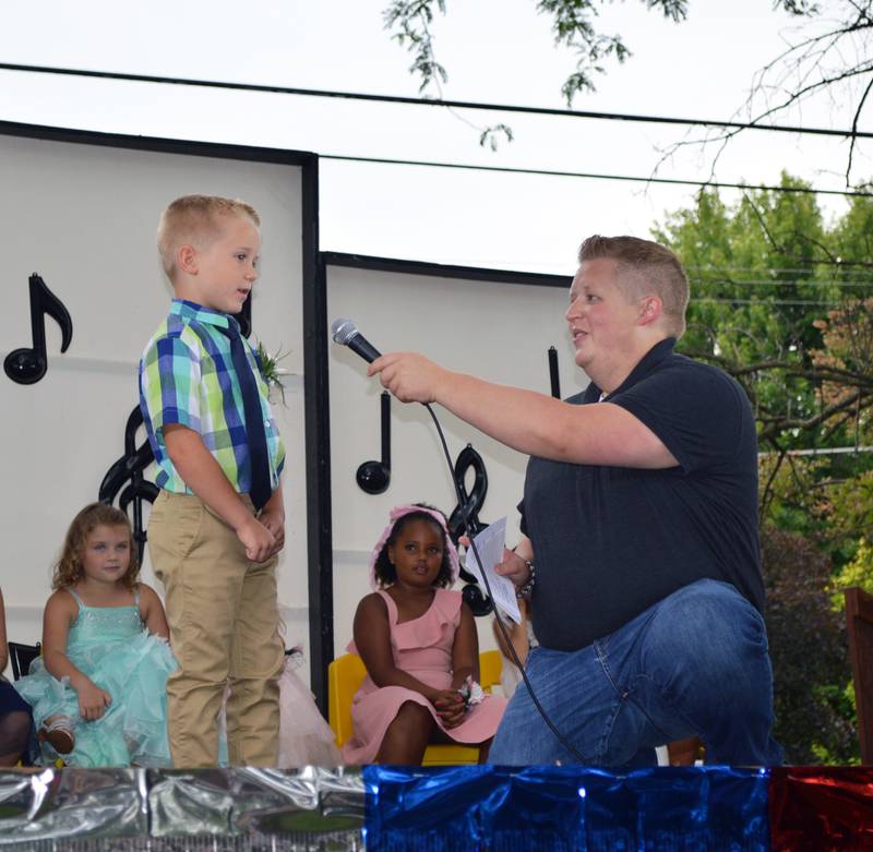 Isaiah Wilken, 5, of German Valley, introduces himself during the 2022 German Valley Little Miss and Mister pageant while host Colin Rust, a German Valley native, holds the microphone. Isaiah was crowned the 2022 Little Mister at the end of the July 16 competition, which took place at Ben Miller Park as part of German Valley Days. There were two boys vying for the title.