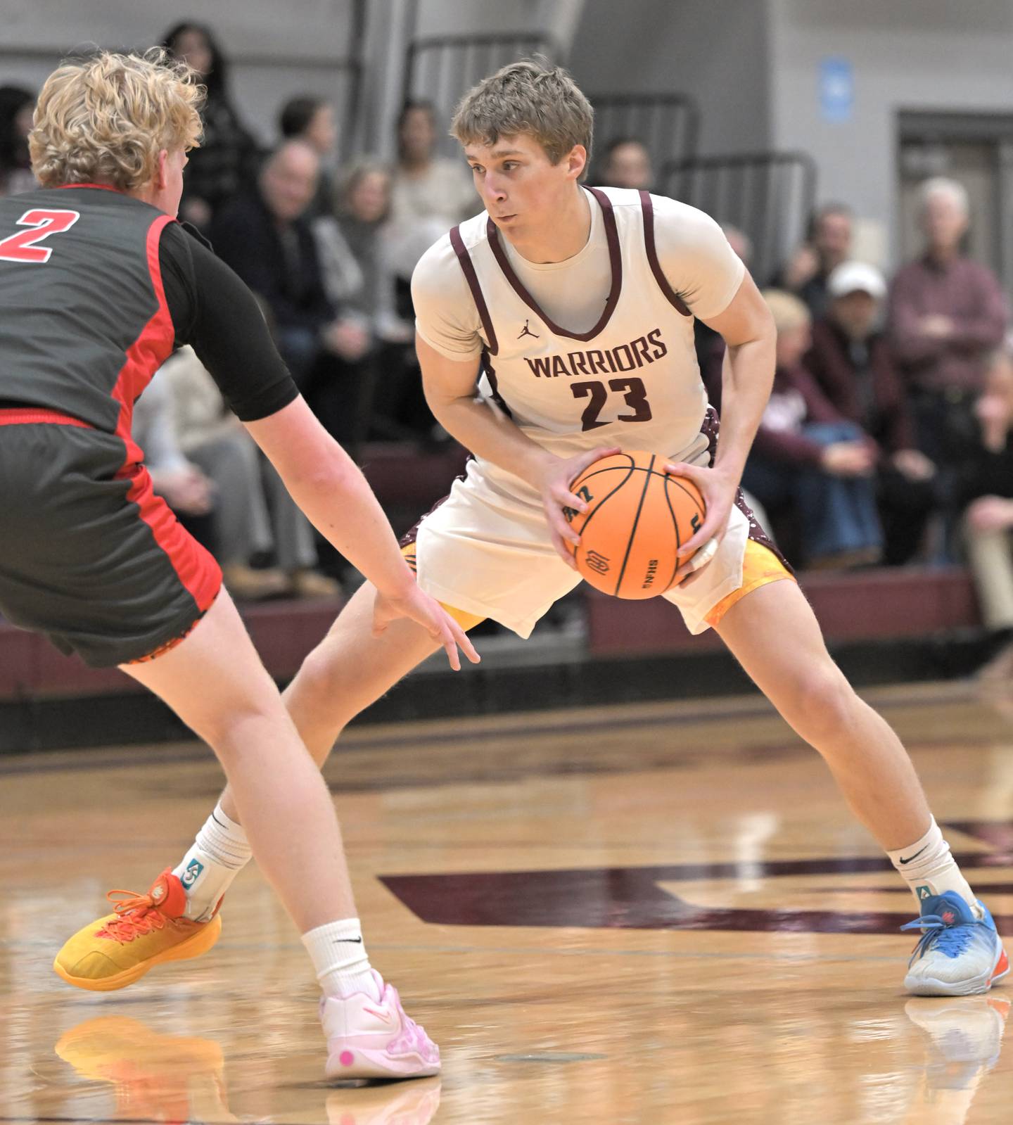 Wheaton Academy’s Hayden Schroeder faces Aurora Christian’s Asa Johnson in a boys basketball game in West Chicago on Friday, Jan. 16, 2026.