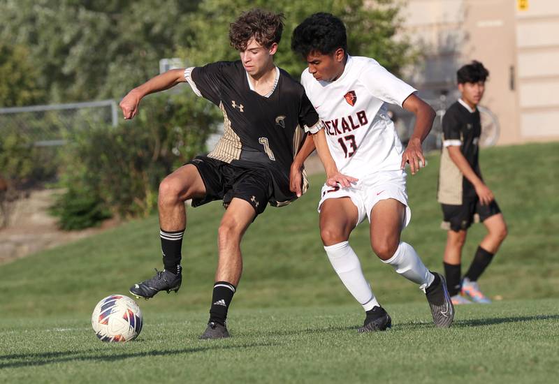 Sycamore's Noah Daykin tries to hold off DeKalb’s Henry Garcia Alvarez during their game Tuesday, Oct. 3, 2023, at Sycamore High School.